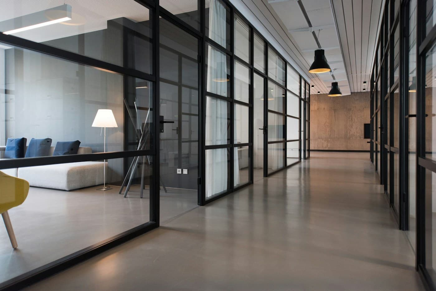 A bright shared workspace with meeting tables and natural light